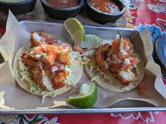 Fish tacos with pico de gallo at Milagros Latin Kitchen for casual events.