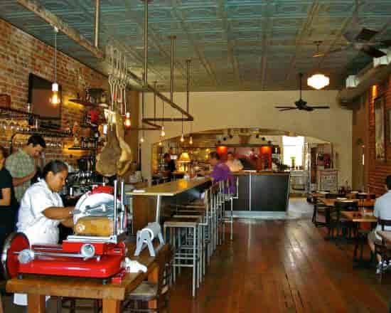 Rustic Diavola Dining Room with warm lighting for intimate gatherings and networking events.