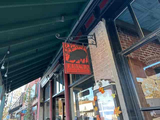 Charming Diavola Pizzeria sign, perfect for outdoor events and gatherings.