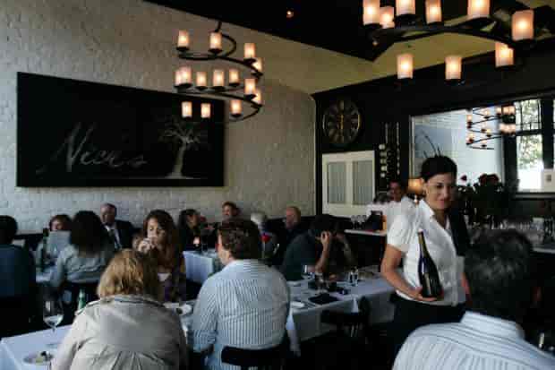 Chic restaurant setting with modern decor, perfect for intimate gatherings and corporate dinners.