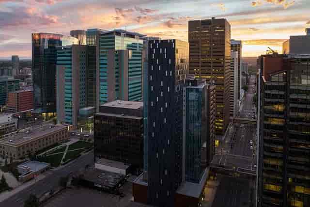 Vibrant sunset urban skyline with modern architecture for events and gatherings.
