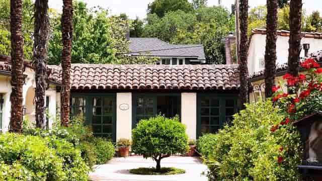 Charming venue entrance at Allied Arts Guild, perfect for outdoor events with lush landscaping.
