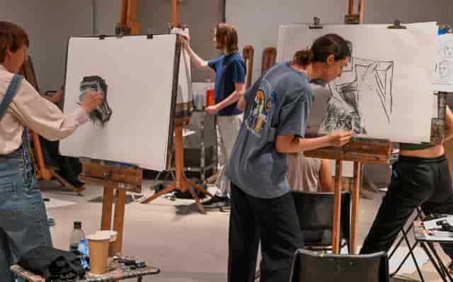 Painting workshop at The Art Academy featuring artists focused on creativity and collaboration.