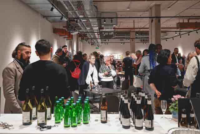 Vibrant networking event at The Hub with engaged attendees in a modern setting.