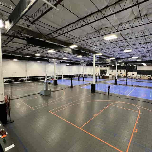 Community Court venue with high ceilings, ideal for sporting events and corporate gatherings.