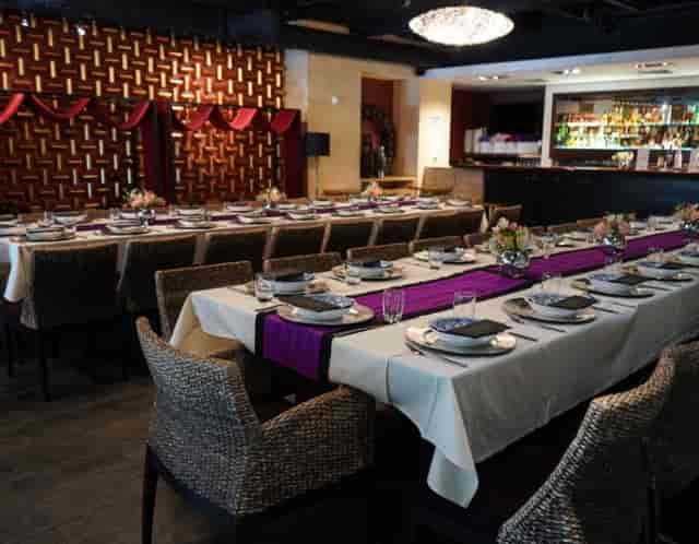 Elegant dining setup with floral centerpieces at Osha Thai Embarcadero for events.