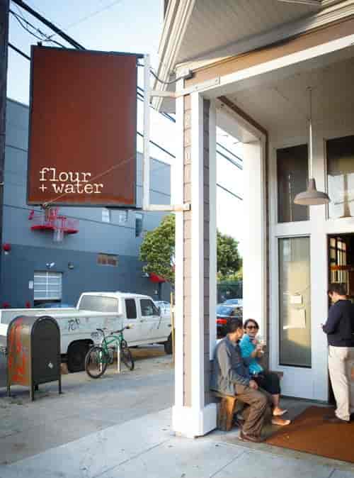 Casual outdoor networking space at Flour + Water with comfortable seating.