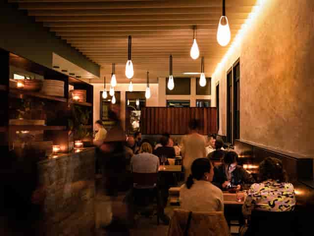 Intimate dining space at Flour + Water, ideal for networking events and gatherings.