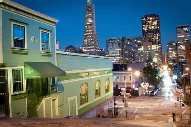 Vibrant Green Tortoise Hostel venue with city lights, ideal for events and gatherings.