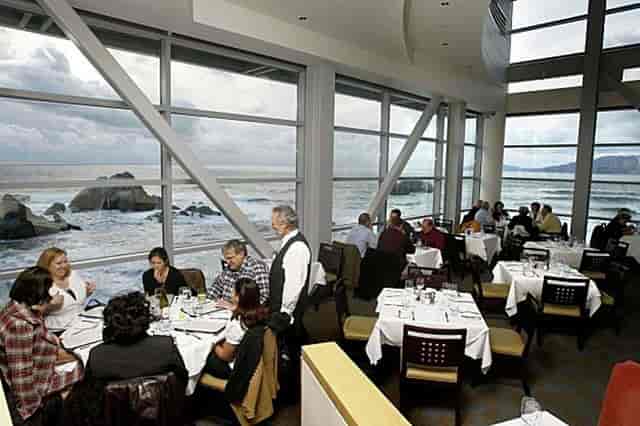 Main Dining Area in Cliff House with ocean view, perfect for corporate events and gatherings.