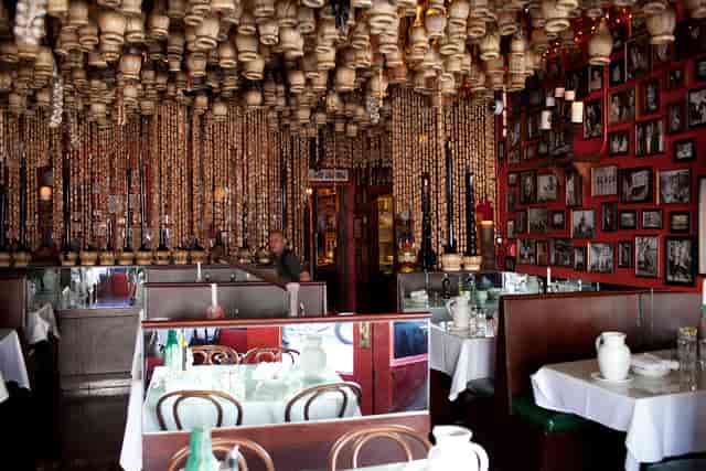 Private dining room at The Stinking Rose with vibrant decor, perfect for intimate events.