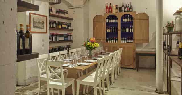Intimate dining space with rustic decor in 54 Mint Cucina Romana for private events.