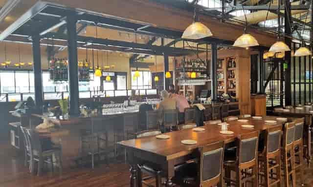 Modern Bistro Boudin with warm lighting, ideal for gatherings and dining events.