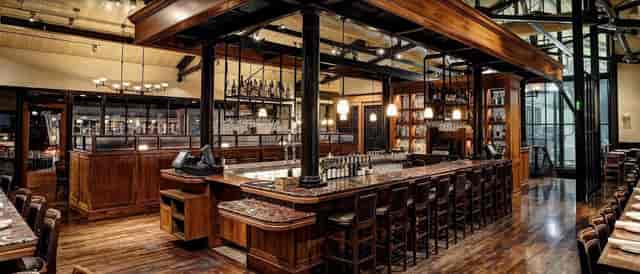 Stylish bar at Bistro Boudin, ideal for cocktail receptions and gatherings.