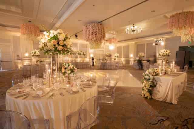 Elegant Ritz-Carlton Ballroom with floral centerpieces, ideal for weddings and galas.