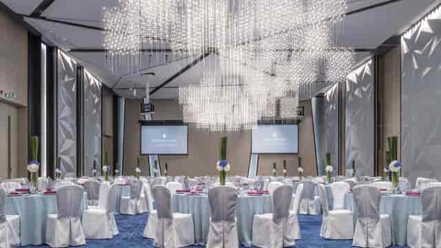 Elegant event space at InterContinental Beijing with pastel decor for corporate gatherings.