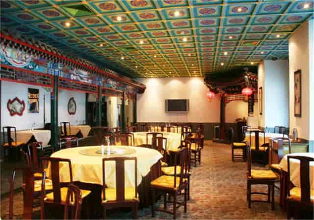 Elegant banquet hall with colorful ceiling for corporate dinners and social celebrations.