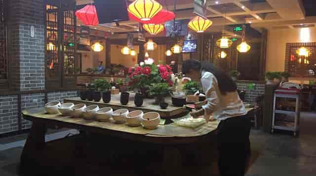 Korean barbecue dining at Huiqiao Hotel Beijing with vibrant decor and cultural experience.