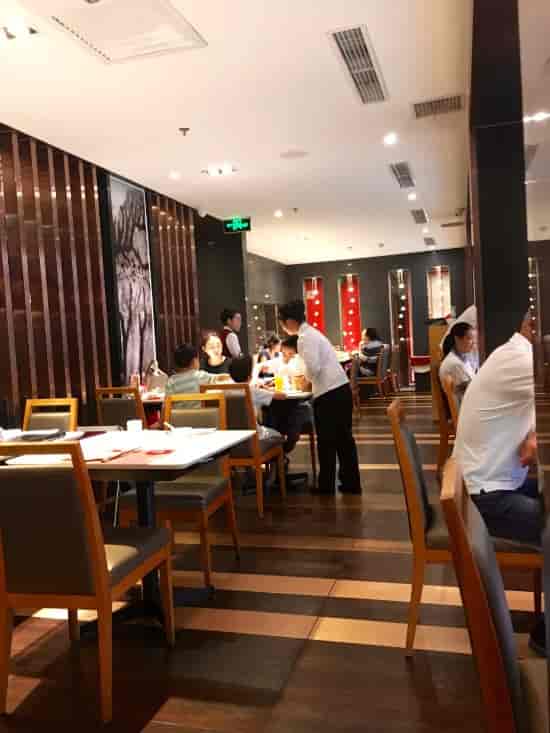 Modern dining space in Yuyang Hotel Beijing, perfect for intimate events and networking.