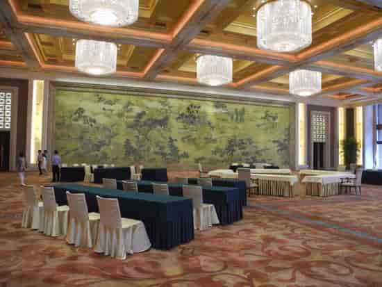 Spacious meeting room in Beijing Hotel, elegant setup for corporate events and conferences.