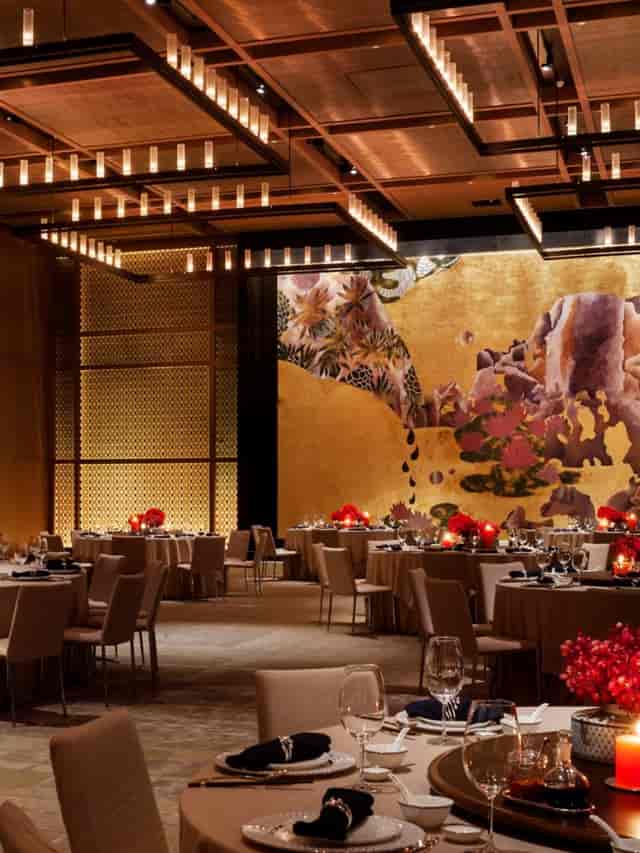 Elegant Beijing hotel banquet hall with golden decor, perfect for gala dinners and corporate events.