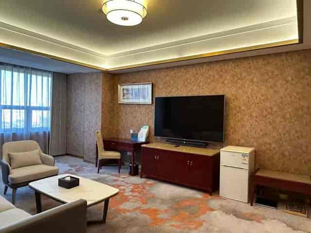 Beijing Jingyi Hotel meeting room with modern decor, ideal for executive briefings.