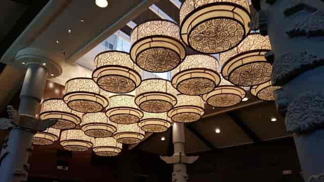 Elegant Koi Palace banquet hall with ornate chandeliers for corporate events and receptions.