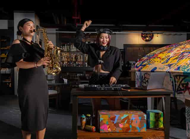 "Performers at L'Atelier by Cyril Kongo, saxophonist and DJ, for vibrant corporate events."