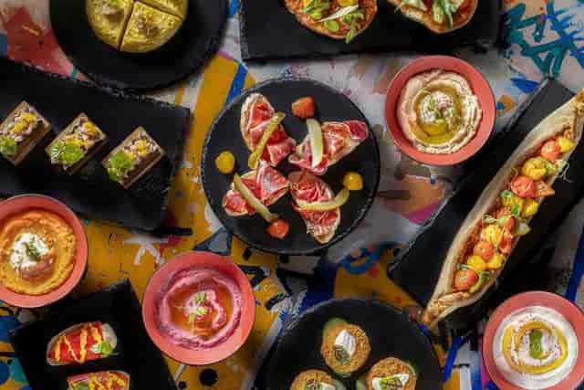 Vibrant dish spread at L'Atelier, perfect for catering events and meetings.