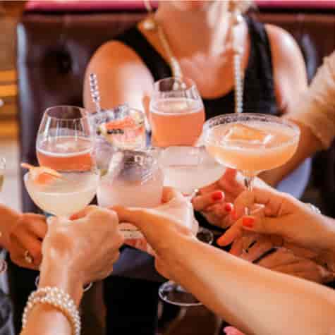 Vibrant cocktail bar gathering at Bar Italia Uxbridge for networking and celebration.