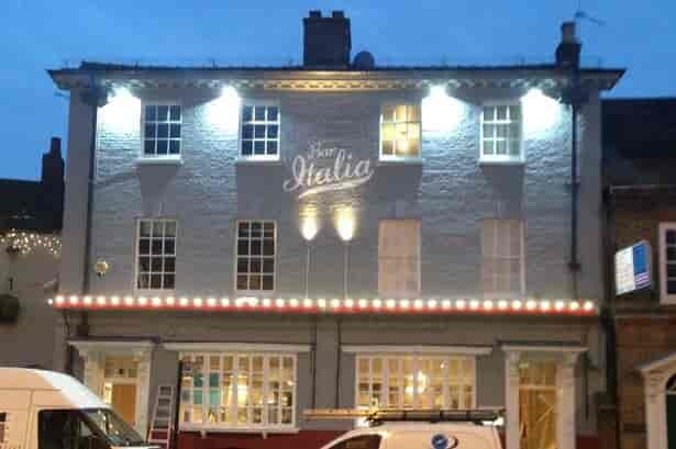 Sports bar in Bar Italia Uxbridge with marquee lighting, ideal for events and gatherings.
