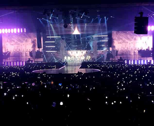 Vibrant concert at Indonesia Convention Exhibition with dynamic lighting and energy.