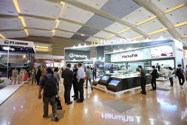 Jakarta International Expo trade show with vibrant exhibitor booths and networking activities.