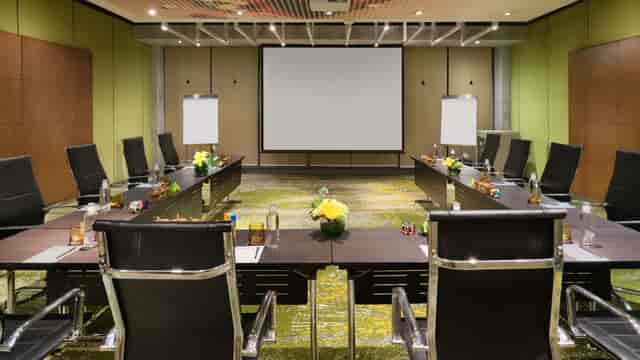 Conference room in Pullman Jakarta, featuring a large table for corporate meetings.