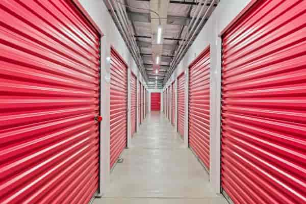 Secure red storage units for efficient event logistics at The Pink Door.