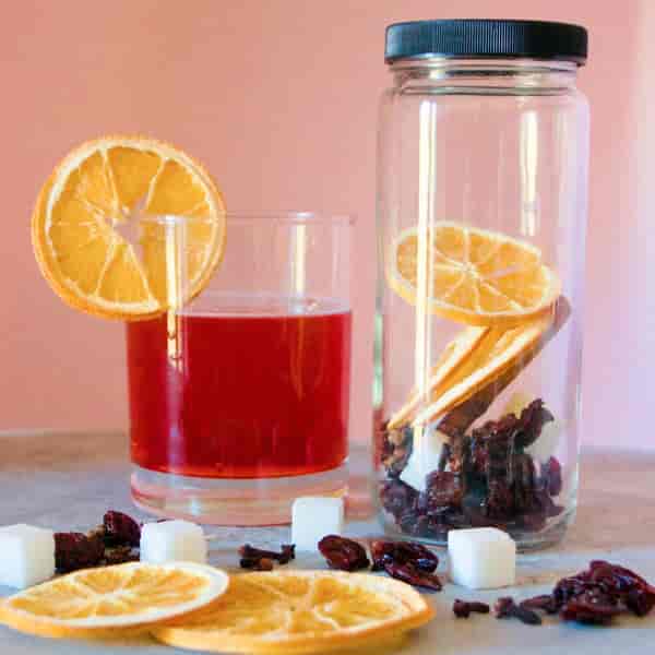 Citrus infusion drink with orange slices at event refreshment station setup