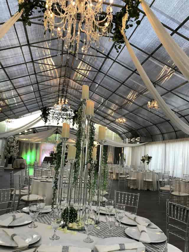"Elegant graduation event at Le Jardin with chandeliers and sophisticated centerpieces."