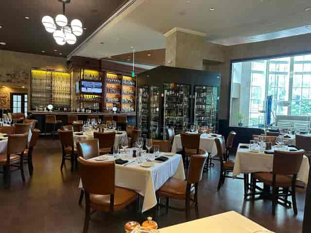 Upscale dining space at The Palm Restaurant, ideal for networking events and celebrations.