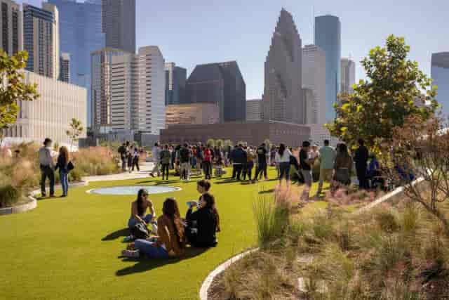 Vibrant rooftop venue with green space for networking and social gatherings.
