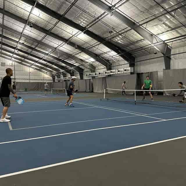 Indoor tennis courts in Houston, perfect for team-building events and corporate retreats.