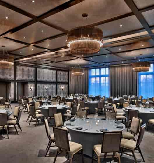 Elegant Meriwether Ballroom with round tables, perfect for weddings and receptions.