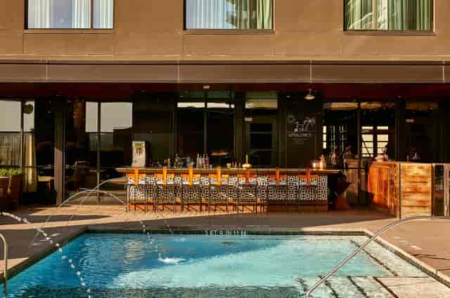 Pool Deck at Hotel Van Zandt, stylish venue with poolside bar for summer events.