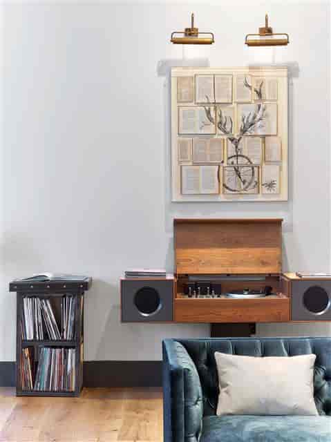 "Lady Bird Foyer at Hotel Van Zandt with vintage record player, ideal for creative meetings."