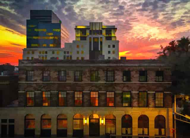 Palmetto at Woodlands Country Club: vibrant sunset over stunning event venue architecture.