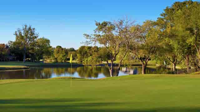 "Quail Valley Clubhouse with lush golf course, perfect for corporate events and team-building."