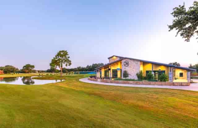 Jersey Meadow Golf Course venue with landscaped lawn, ideal for weddings and corporate events.