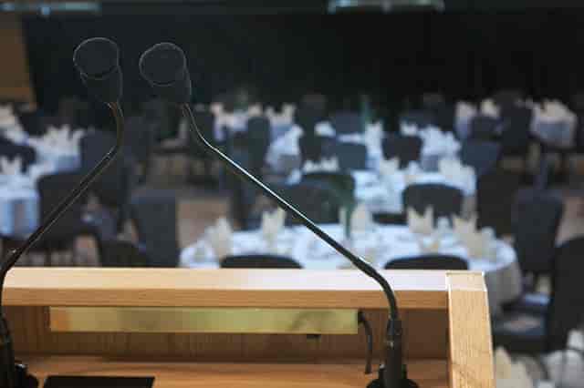 Executive Room at The Pinnacle Center set up for conferences and banquets, featuring podium.