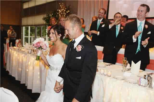 "Joyful newlyweds at elegant wedding reception in The Pinnacle Center's Executive Room"