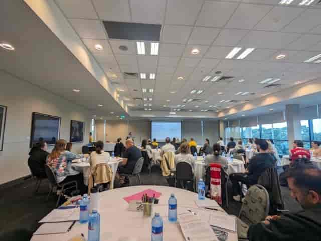 Modern conference room with engaged attendees at Aspire Events meeting.