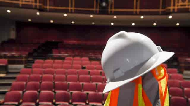 Hard hat and safety vest at Henry LaBrun Studio, preparing for events in Wortham Center.